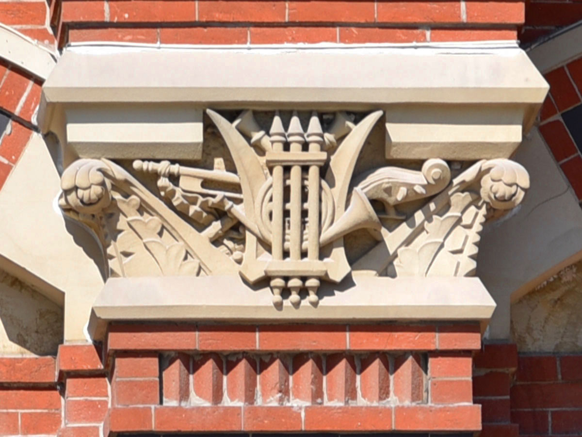 Sandstone carving of music symbols representing center 