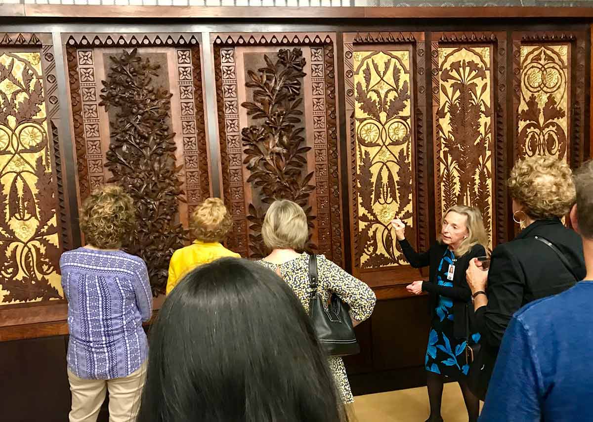 Guests with art-carved organ panels in Music Hall
