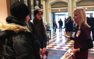 SPMH Volunteer Becky Moeggenberg with Open House guests