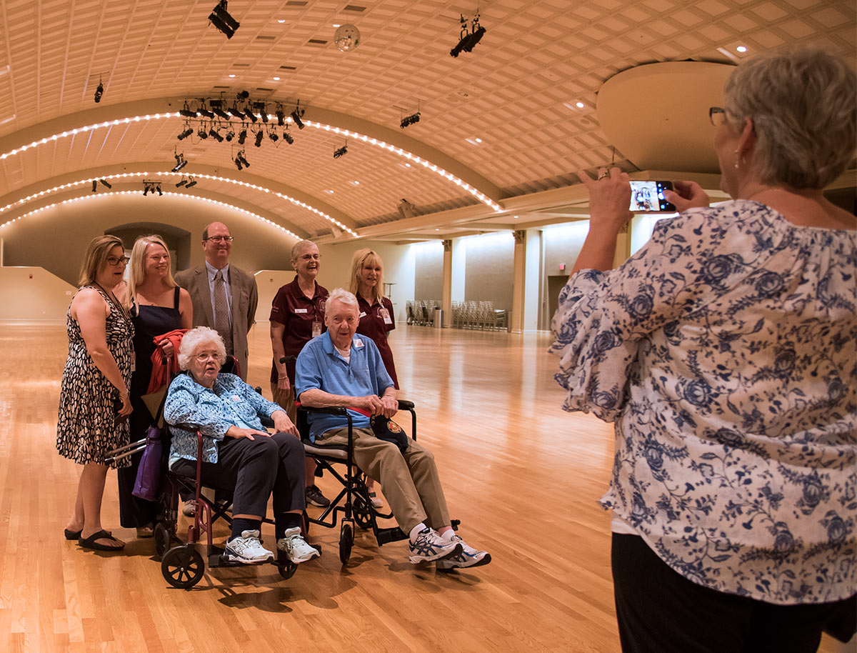 Left to Right: Volunteer Dir. Ramona Toussaint, Boardmembers Holly Brians Ragusa and Ken Kreider and Tour Guides Sue Monteith and Becky Moeggenberg with Pat and James Mack