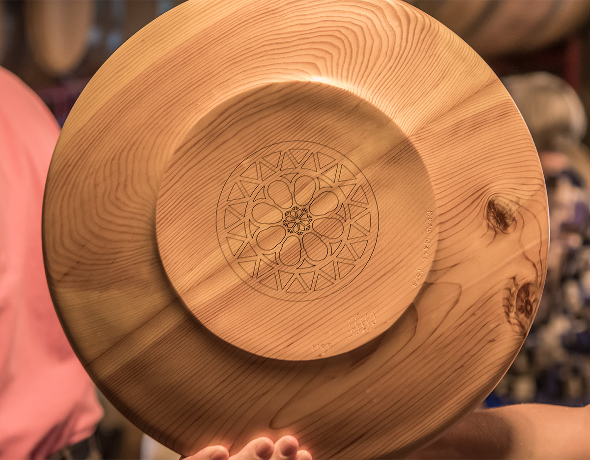 The Music Hall Rose Window design, etched into the bottom of the beautiful hand-carved plate.