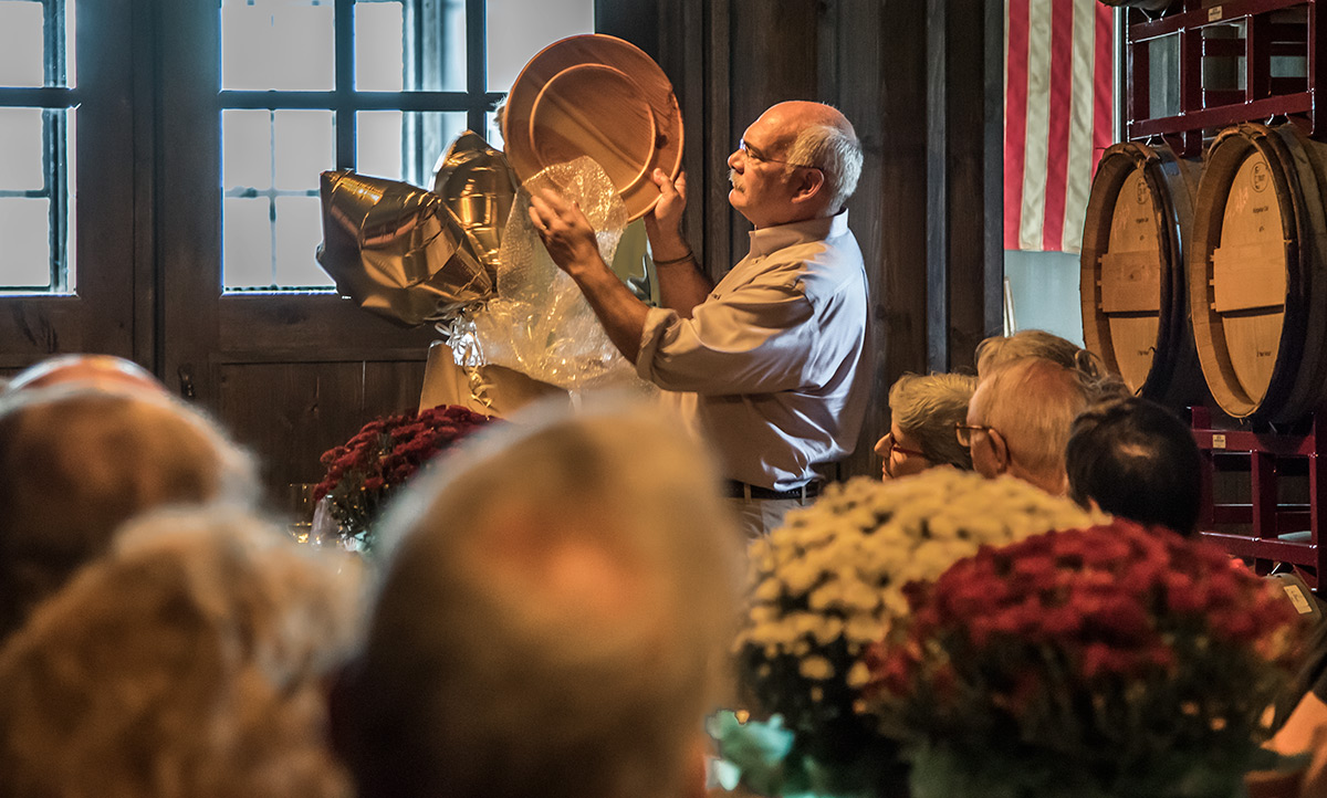 Scott showed the hand-carved plate with the rose window etched on the bottom.