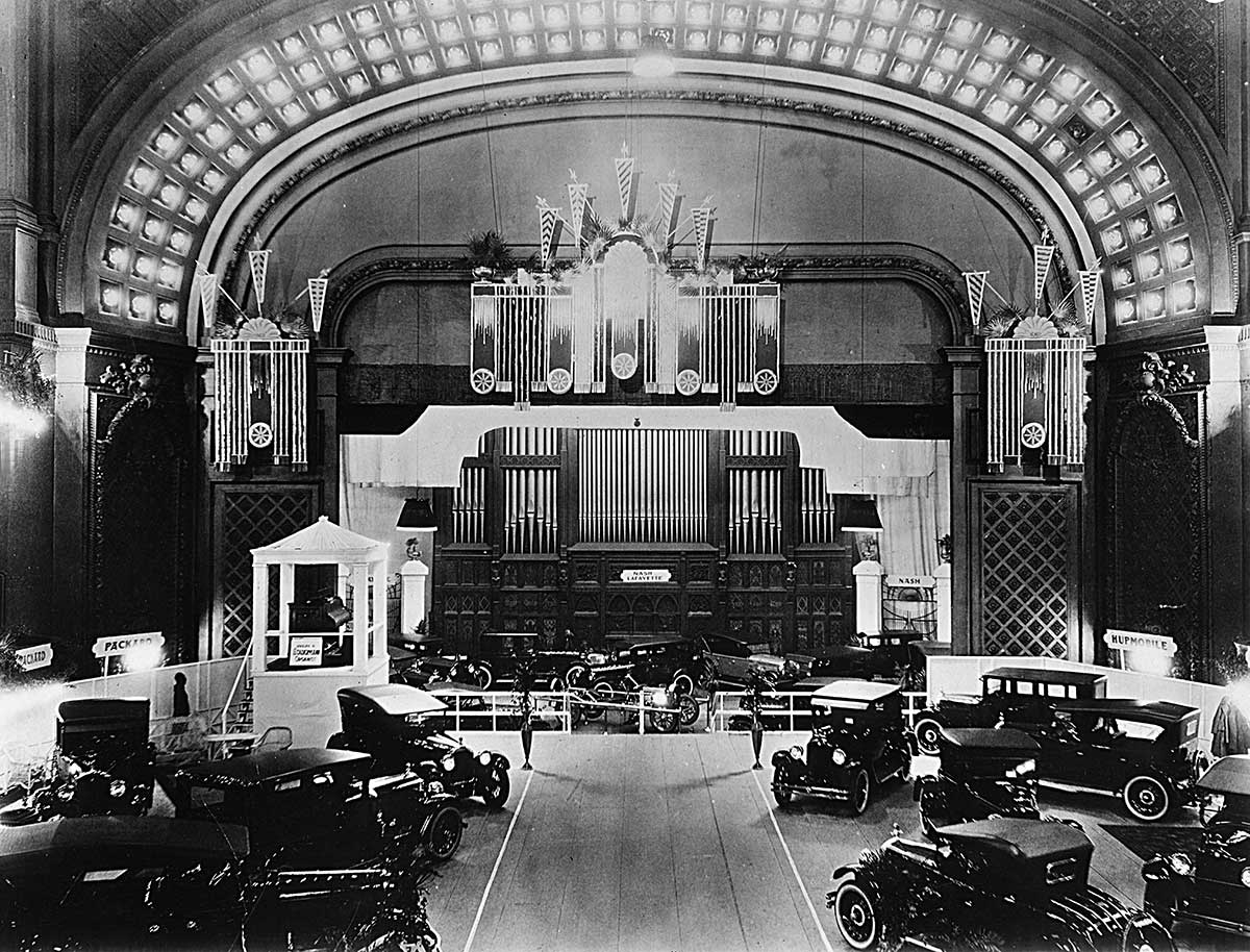 Auto Expo circa 1920s Cincinnati Music Hall shows Autos on floor over seats in Springer Auditorium