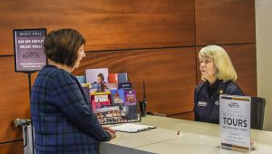 Executive Director Mindy Rosen chats with Lynne Reckman at the Information Desk at Cincinnati Music Hall