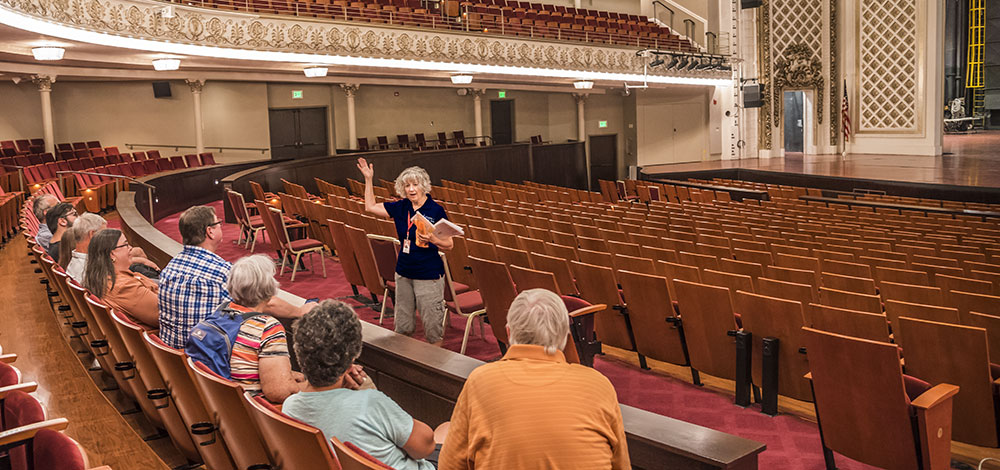 Friends of Music Hall Volunteer Patti Cruse leading a tour in Cincinnati Music Hall