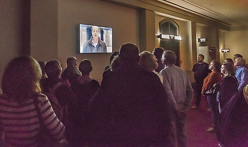 Ghost Tour guests listen as one man describes his encounter in Cincinnati Music Hall.