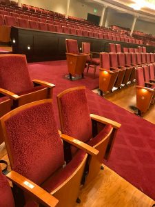 Photos of “Estella Cavanaugh Rowe” brass plaque on orchestra right, row N, seat 302