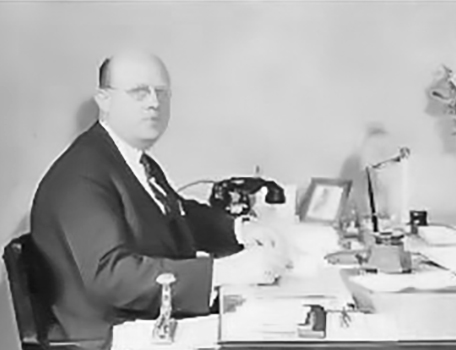 John J. Behle at his desk