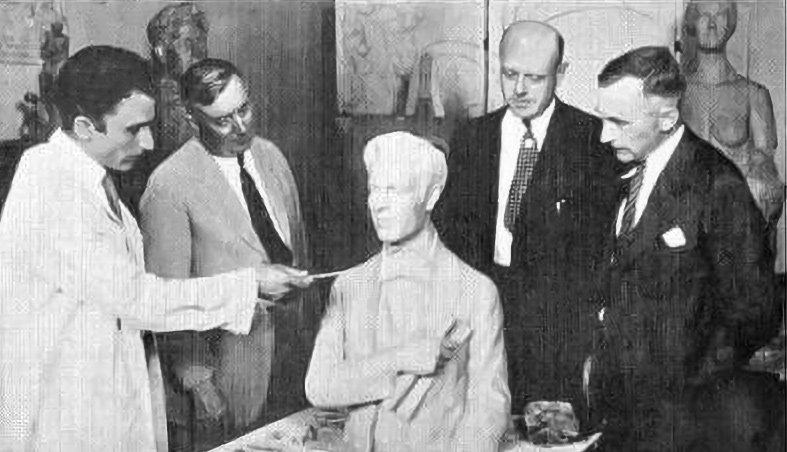 L->R: Sculptor Arturo Ivone presents the bust of Stephen Foster to Ernest Gwinner, Exposition Board; John J. Behle, Music Hall manager; and Cincinnati councilmember W. Meredith Yeatman