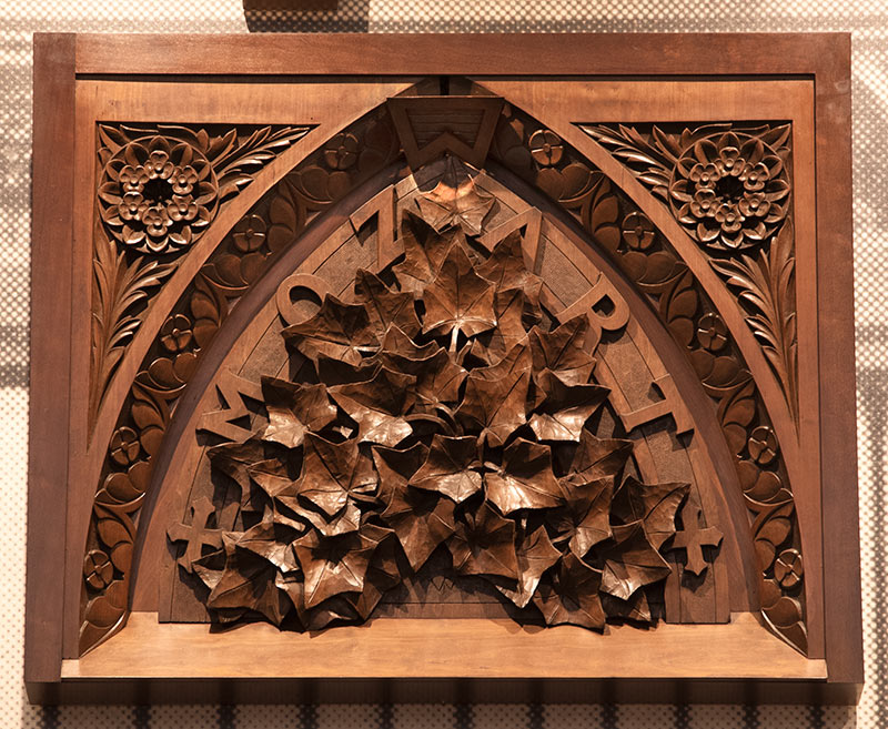 The organ panel titled "Mozart with Ivy Leaf," designed by Laura Fry and carved by William Fry