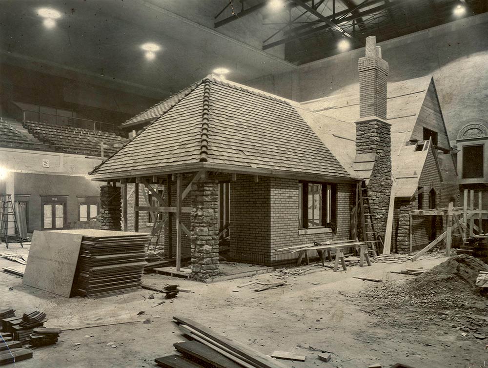 The 1929 Model Home being construction inside Music Hall's north wing for the Home Beautiful Exposition.