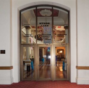 Photo from 2016, of South Corridor Lobby, carpet and doors