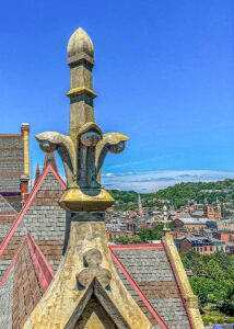 Photo of a restored finial atop north hall's gable