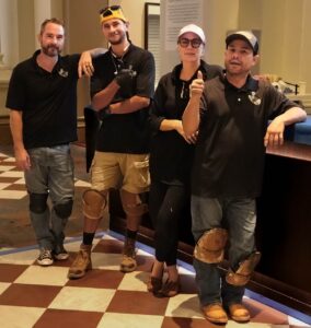 photo of the Eighth Day Stone Restoration Team, L-R: Kenneth Lambert, Marcel?, Rachel, and Marcel?