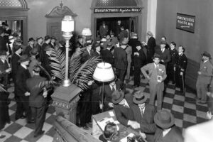 1928-North Corridor Lobby, checkerboard stone floor at the foot of the grand staircase.