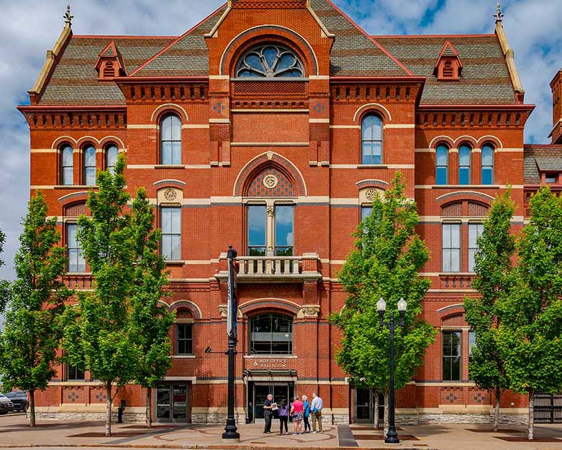 Friends of Music Hall tour group, with volunteer guide Dale Pepper, in front of north hall.