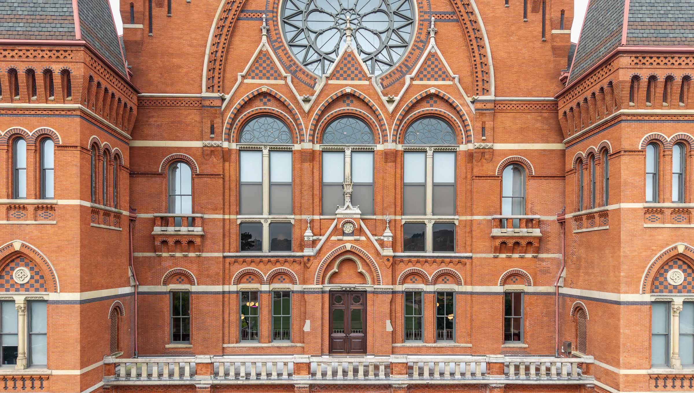 Exterior with restored balcony doors. Photo by J. Miles Wolf Photography.