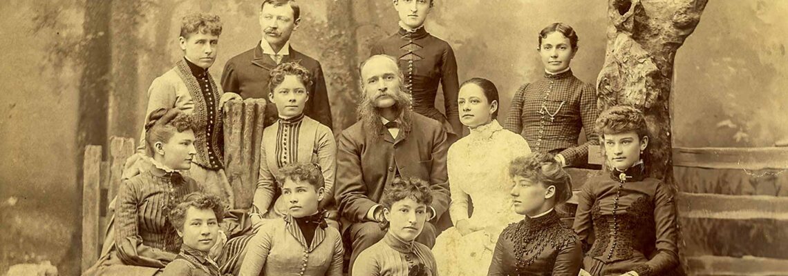 Featured image showing Professor Preston Powers, center, Women Students in Sculpture Class at School of Fine Arts, Denver University, Courtesy Special Collections and Archives, University of Denver.